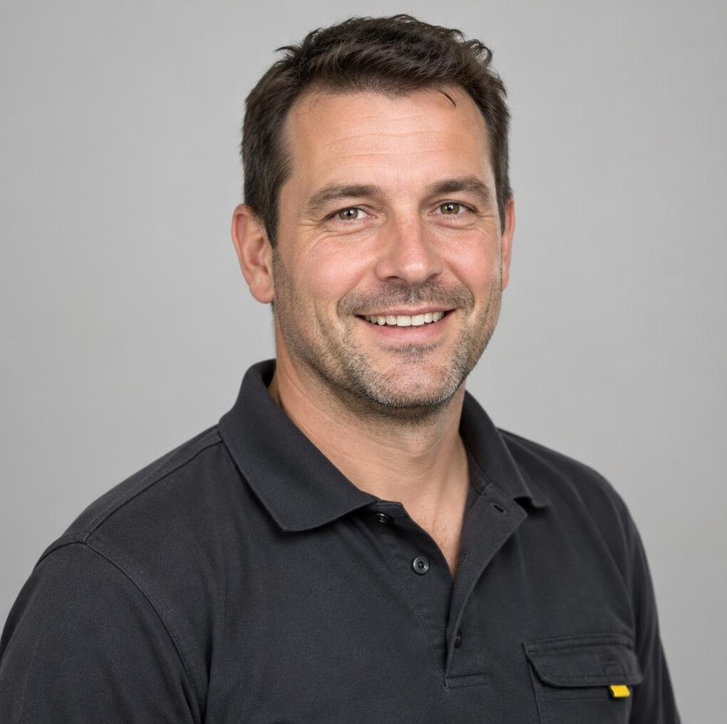Portrait of a smiling man with short dark hair